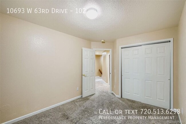 Building Photo - 10693 W 63rd Dr