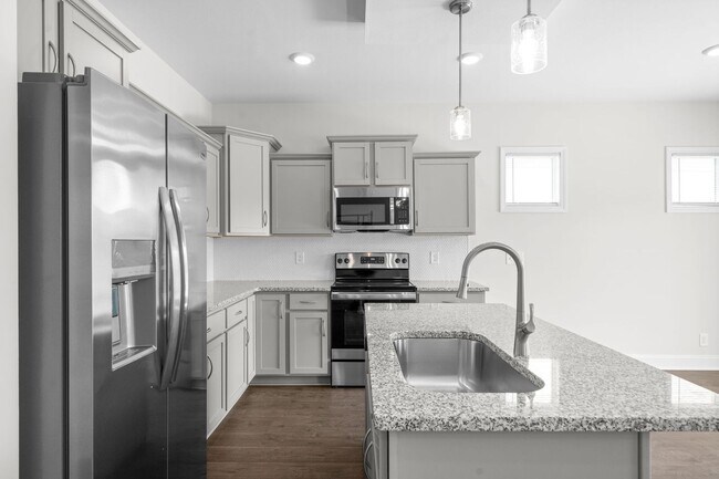 Building Photo - Pet Friendly Three Bedroom with Bonus!