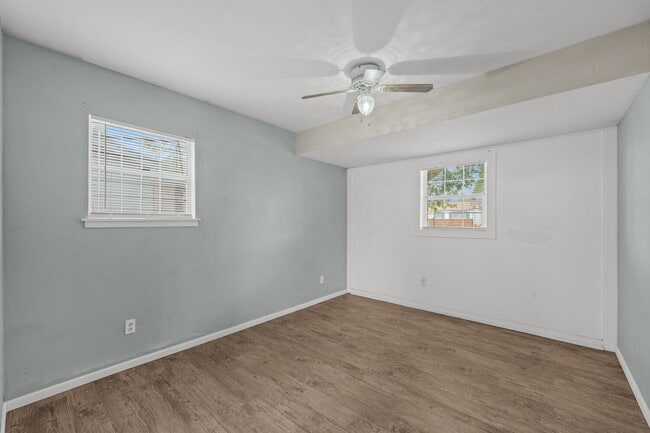 Building Photo - Updated Home with Gorgeous Floors & Large Backyard
