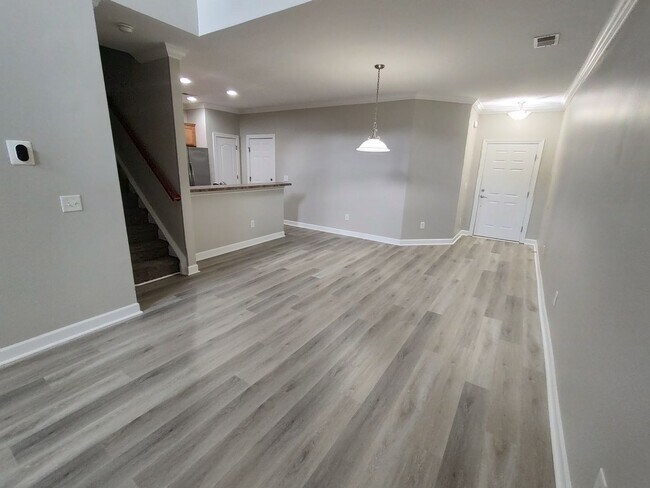 Building Photo - BRAND NEW FLOORING & FRESH PAINT - 3 Bedroom/2.5 Bath Townhome with garage in Wild Wing!