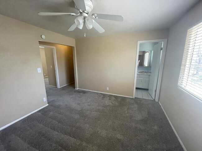 Building Photo - Spacious 6-Bed Oasis with Finished Basement & Cozy Fireplace.