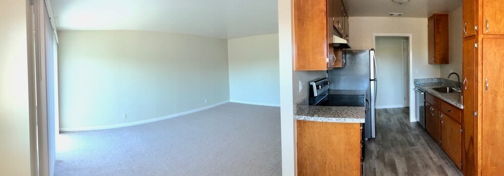 panorama of living room and kitchen from dining room - Merrilee Terrace Apartments