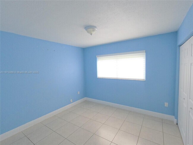 Building Photo - 9911 W Okeechobee Rd