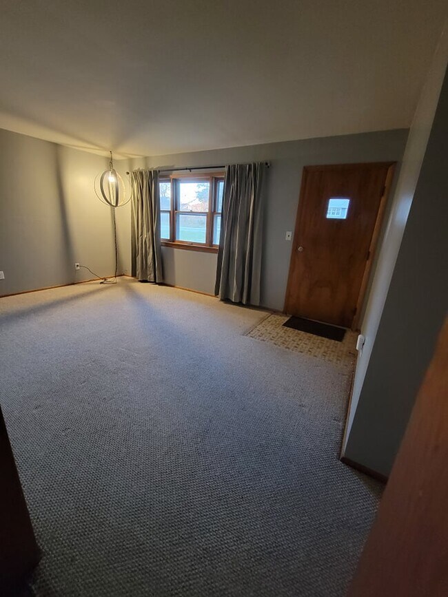 Living room from kitchen - 104 S Park St