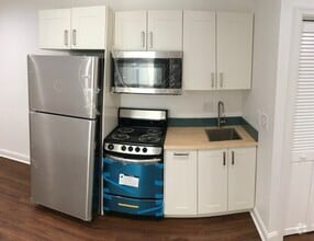 Building Photo - Big Style, Bright Spaces & City Vibes — We...