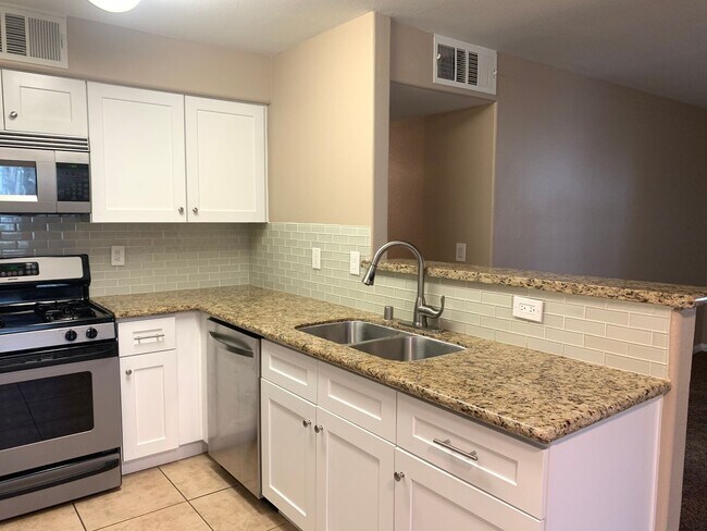 Building Photo - Thrive in this upgraded first-floor two be...