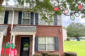 Building Photo - Welcome to this stunning 2-bedroom, 2.5 bathroom corner townhome located in the vibrant city of A...