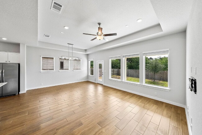 Building Photo - Greenbelt. 3 Car Garage. Built In Dog Room.