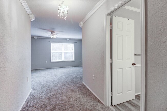 Building Photo - Gated Tampa Palms Townhome with 2-Car Garage, Screened Lanai & Community Pool