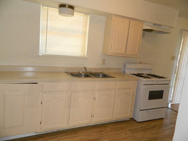 Building Photo - MOVE IN SPECIAL $500 OFF ON THE FIRST MONTH'S RENT! COMING SOON! Classic 4-Bed, 1.75-Bath Brick H...