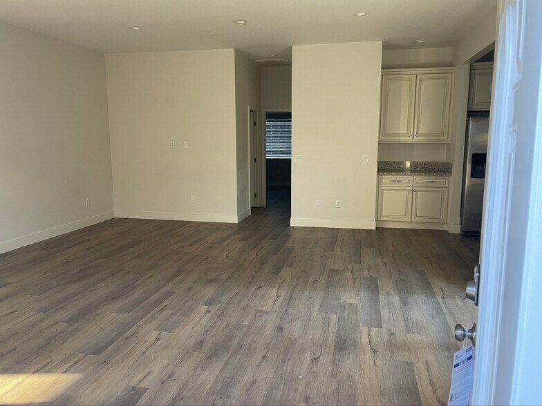 walking in living room - 6227 Atoll Ave