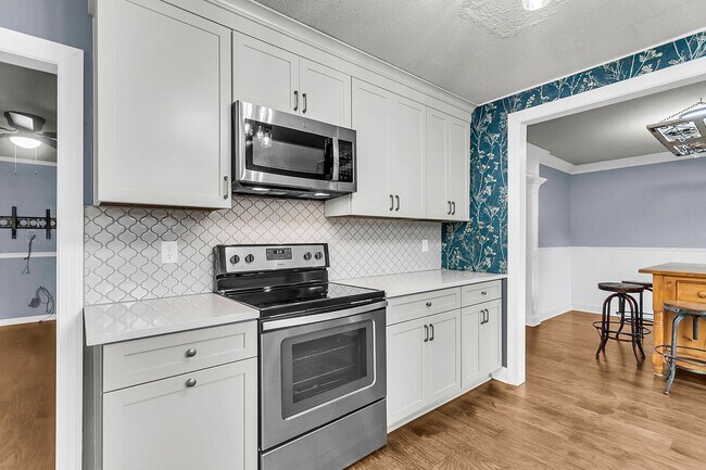 Building Photo - Charming Updated Home with Designer Kitche...