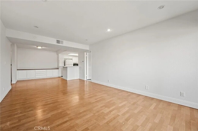 Building Photo - "Chic 1-Bed Retreat with Pool & Central Vacuum in Anaheim's Heart – 710 Sq Ft of Hardwood Elegance!"