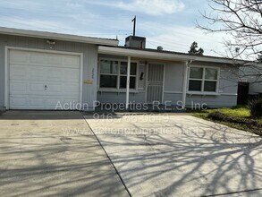 Building Photo - Close to Freeway, Shopping Single Story 2 Bedroom 1 Bath Large yard 1 Car Garage Drought Resistan...