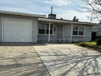 Building Photo - Close to Freeway, Shopping Single Story 2 Bedroom 1 Bath Large yard 1 Car Garage Drought Resistan...