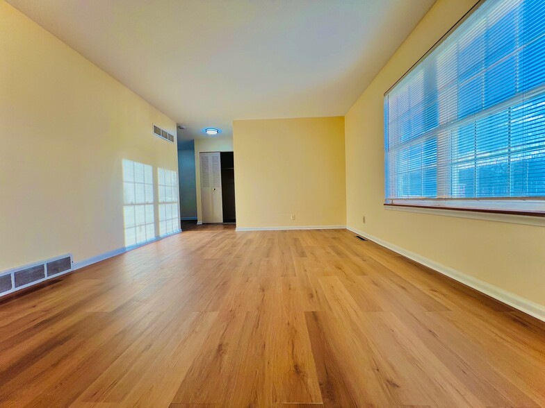 Living Room with new luxury vinyl plank flooring - 9315 Bluejacket St