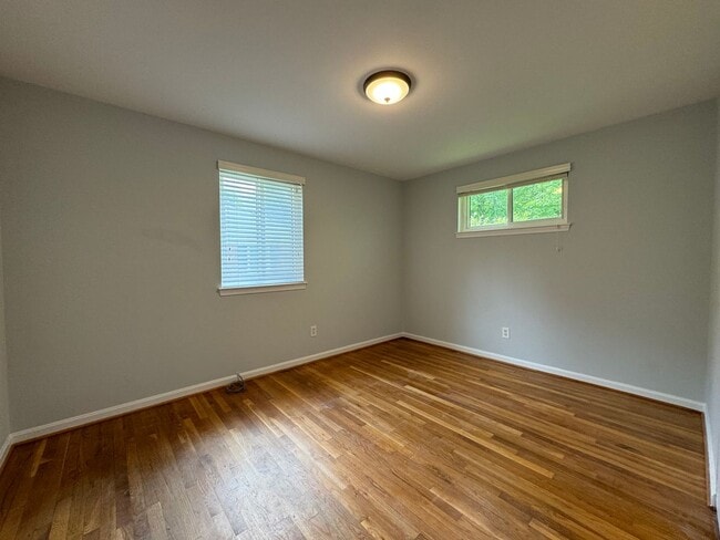 Building Photo - Sought-After 4 Bed 3 Bath L-Shaped Rambler...