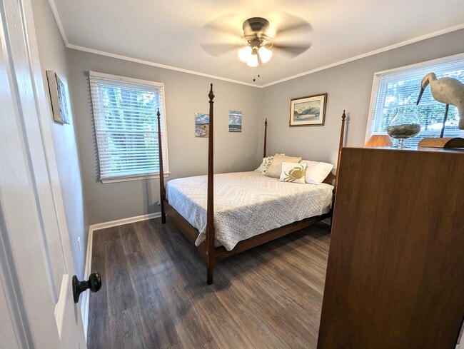 Bedroom 1 is bright and inviting. Queen bed, original art and a closet. - 4107 Crane St