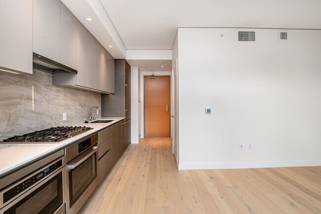 Building Photo - Urban Oasis at Spire Condominiums – Modern...