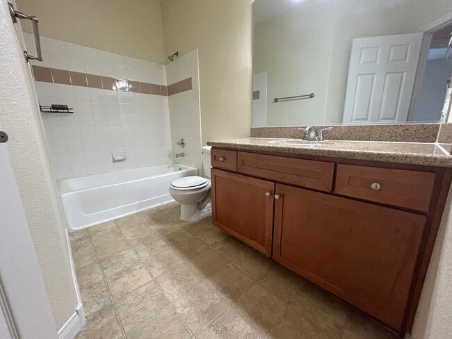 Building Photo - ADORABLE 2 BEDROOM 2 BATHROOM CONDO LOCATED IN A GATED COMMUNITY