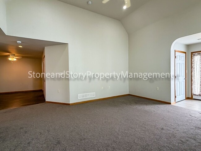 Building Photo - 2 bedroom 1.5 bath duplex with sunroom, 2 car garage and fenced yard