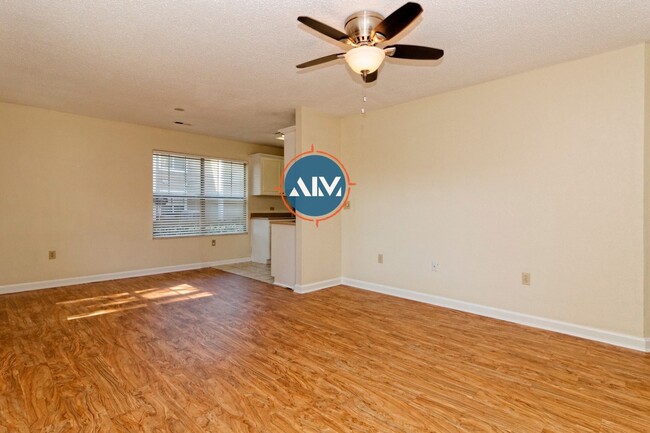 Building Photo - Charming First-Floor Condo with Pond Views at The Estate at Westbury