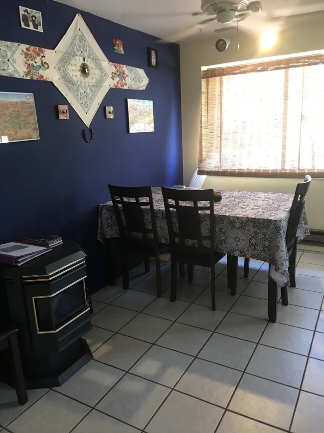 Dining area with pellet stove. - 224 Hopi Ave