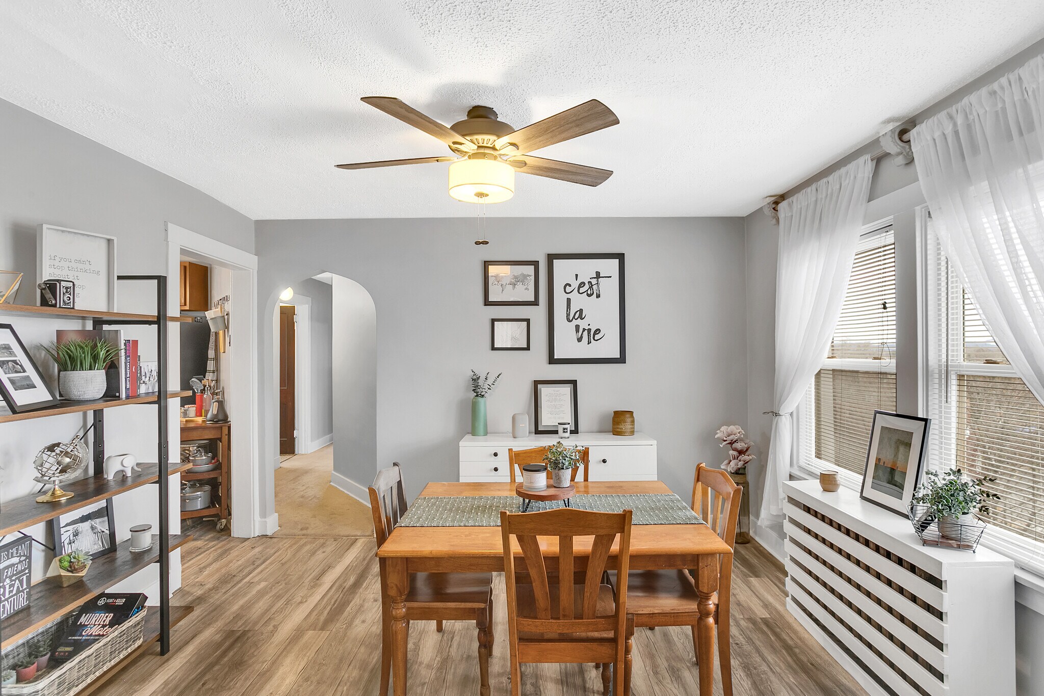 Formal dining room featuring elegant archways and plenty of space for family meals. - 203 Richbarn