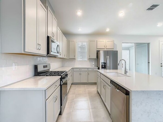 Building Photo - New Luxury Townhome in Celebration with All porcelain tiled floors. Island Village new construction