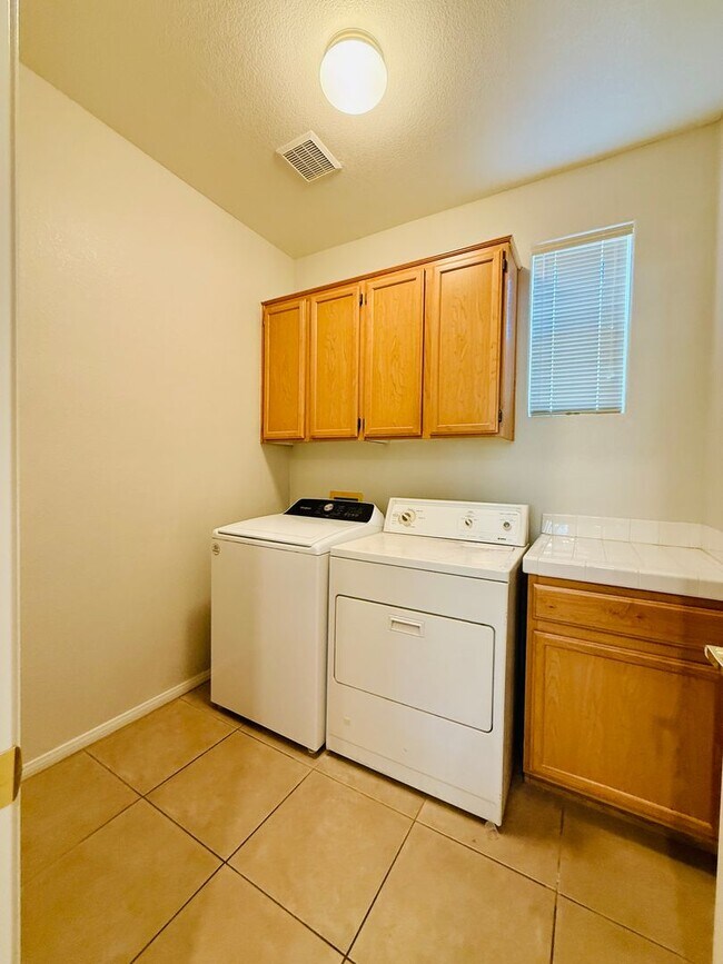 Building Photo - Immaculate and Inviting Two-Story Condo in...