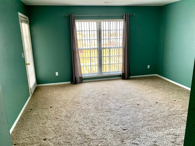 Master bedroom with a porch walkout. - 51870 Adler Park Dr E