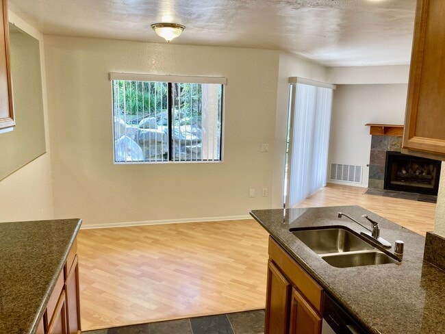 Building Photo - One Bedroom with Garage and IN-Unit laundry in Resort-Style Complex