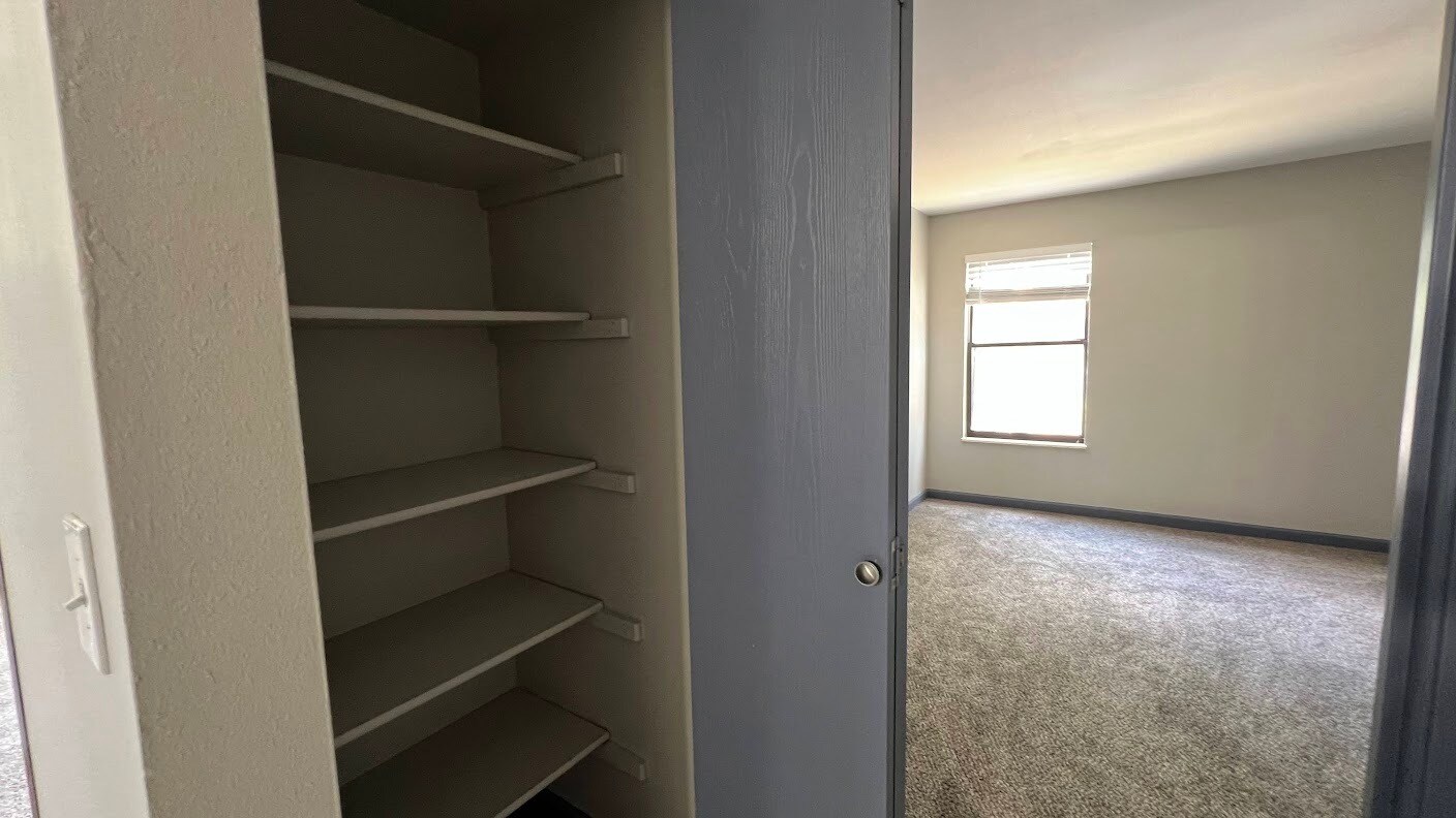 Convenient linen closet with extra storage space. - 12063 E Harvard Ave