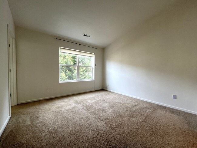 Building Photo - Beautiful 2 Bedroom Townhome with Walk-In Closets Private Deck & Attached Garage