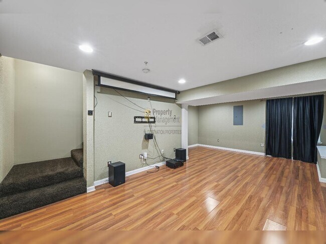 Building Photo - "Charming Lenexa Townhouse: Spacious 2-Bed Retreat with Finished Basement & Gleaming Hardwood Flo...