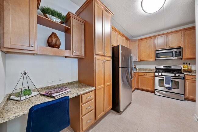 Wood-accent kitchen with stainless steel appliances - The Easton Downers Grove
