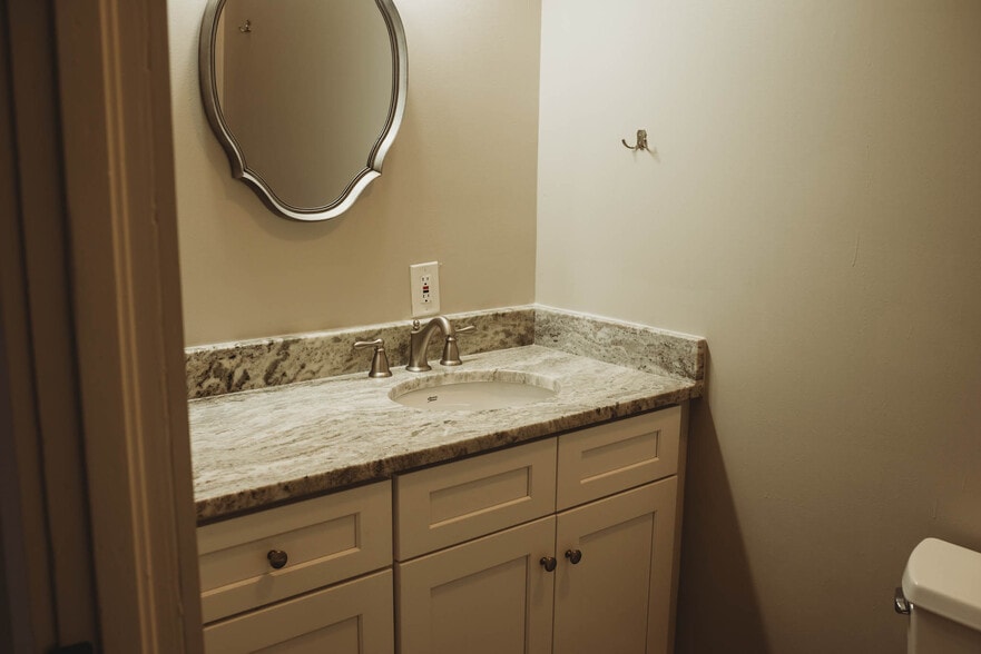Bath with stone countertop - 529 Washington E St