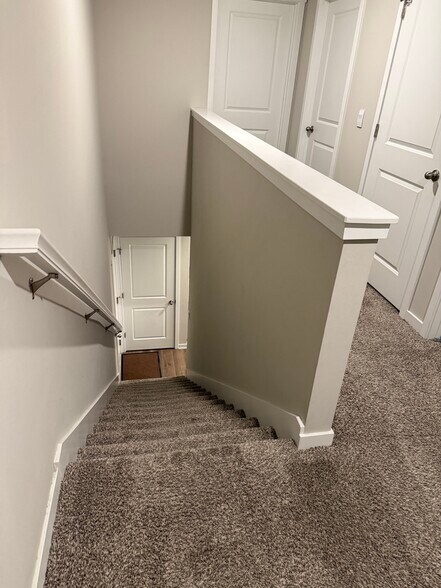 Stairs to upper floor - 4521 SE Ember Ln