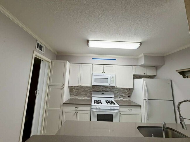 Building Photo - Modern Medical Center Gem with Stylish Upgrades & Private Patio Living