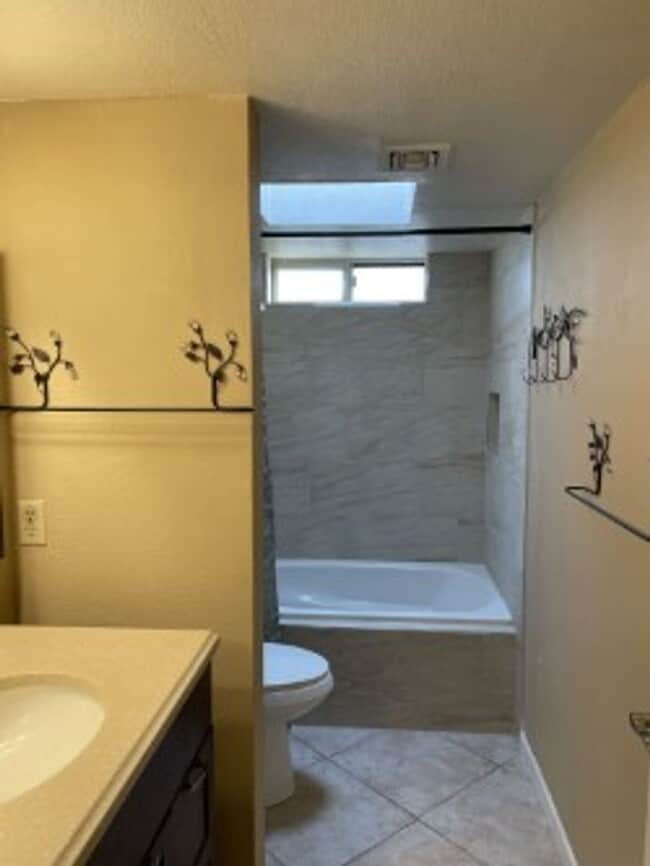 Building Photo - Spacious 3 bedroom, 3 bath, condo with a l...