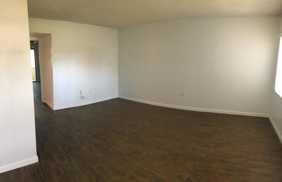 Living room opens to dining room - 1051 79th Ave N