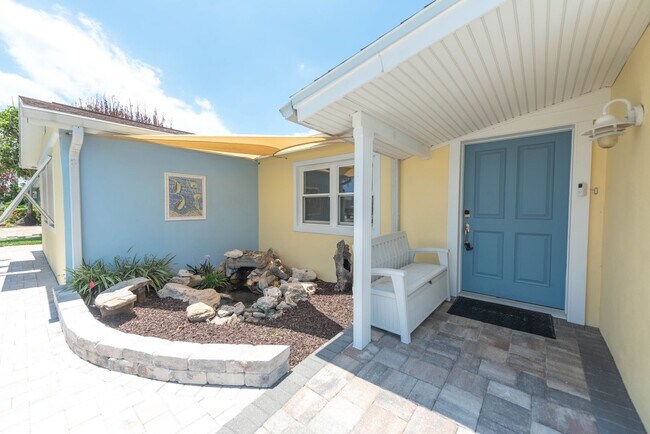 Building Photo - Live the ultimate Space Coast waterfront lifestyle at this stunning beachside canal home in Satel...
