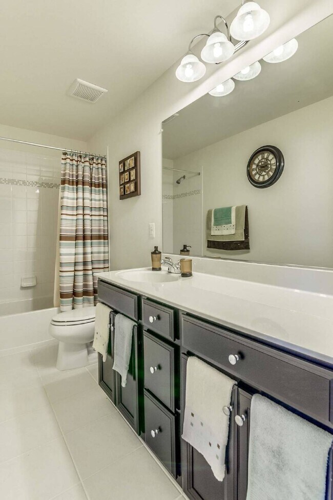 Building Photo - 3-bedroom, 2.5-bathroom condo with a great open-concept main level.