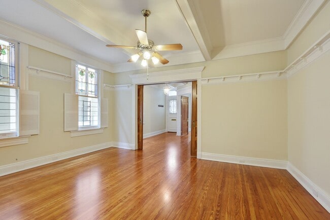 Building Photo - Fabulous University Duplex with gleaming floors and stained glass.