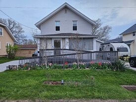 Front of house, driveway on either side - 4047 Mogadore Rd