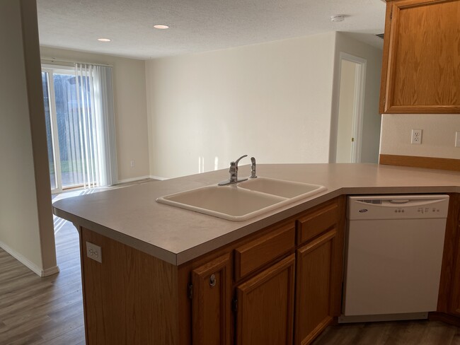 Kitchen looking into dining - 7345 Parkplace Dr NE