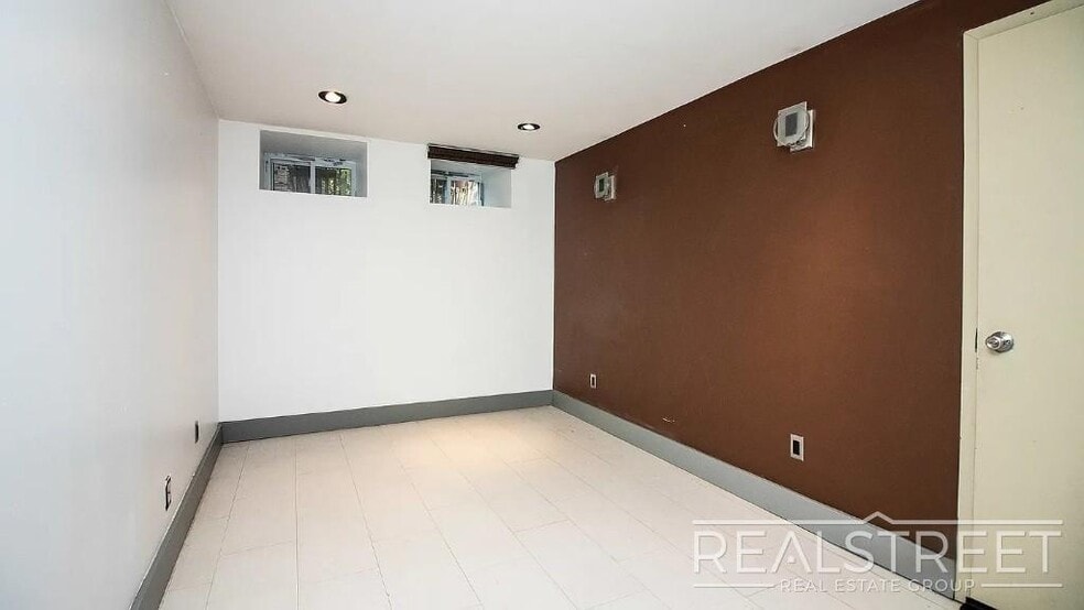 Building Photo - Gut-Renovated 3BR + Massive Finished Basement | Backyard, Laundry & HVAC | Bushwick