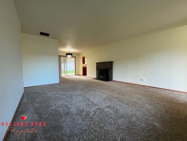 Building Photo - Beautiful Remodeled Rambler!!!  Come enjoy this HUGE backyard!!  NEW CARPET!!