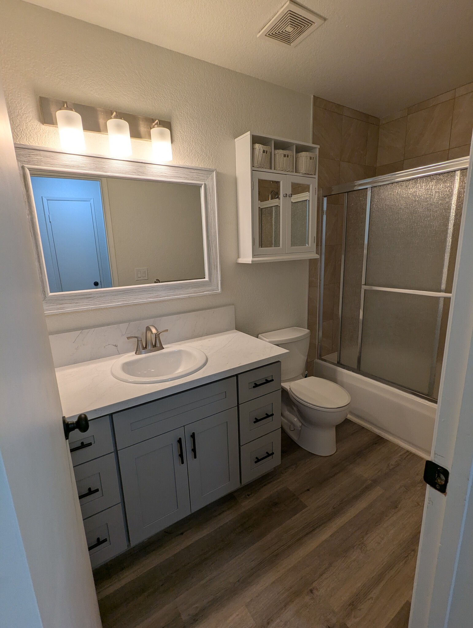 Remodeled bathroom with quartz counter and new cabinets - 4918 Saddlerock Way