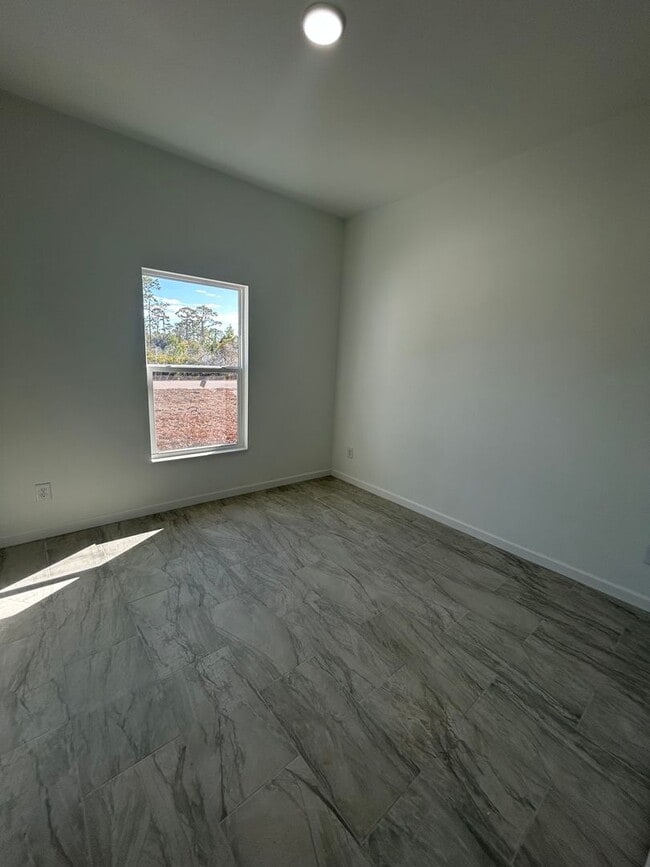 Building Photo - BRAND NEW Modern 4BR/2BA Home with Garage – Peaceful Lake Placid Retreat